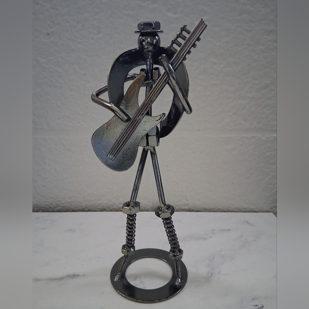 Handmade Metal Sculpture of a Musician Playing a Guitar